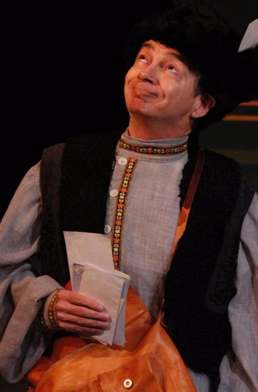 Man with silly costume and look on his face in "Fools."